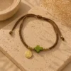 ChatGPT Image Jul 1, 2026, 04_02_01 PM Handmade Bracelet String Tan Cross Green