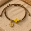 ChatGPT Image Jul 5, 2026, 08_12_06 PM Handmade Tan String Bracelet with Yellow Cross