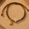 ChatGPT Image Jul 5, 2026, 08_15_37 PM Handmade Tan String Bracelet with Tan Cross