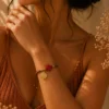 ChatGPT Image Jul 5, 2026, 08_20_56 PM Handmade Tan String Bracelet with Red Cross