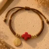 ChatGPT Image Jul 5, 2026, 08_22_24 PM Handmade Tan String Bracelet with Red Cross